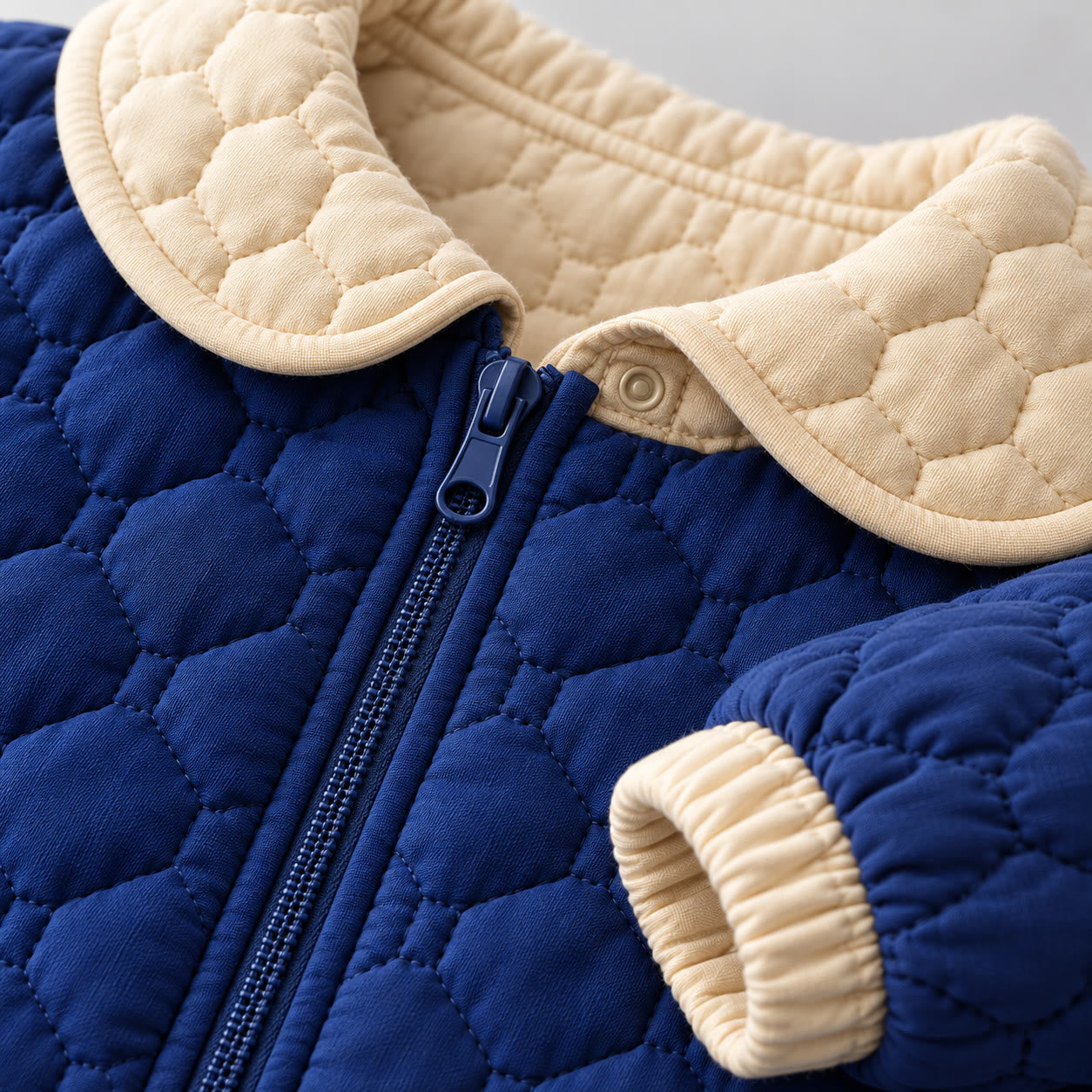 Cobalt and milk quilted jacket detail